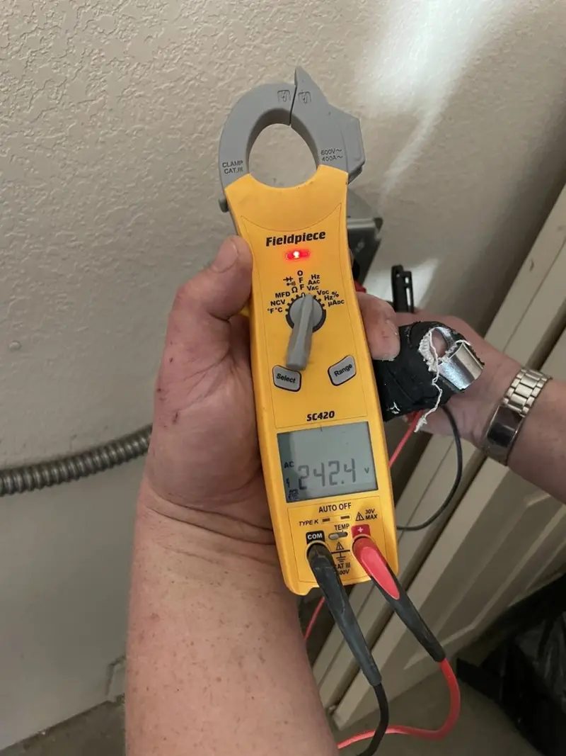 Voltage testing with clamp meter during Aluminum Wiring Replacement in Alma